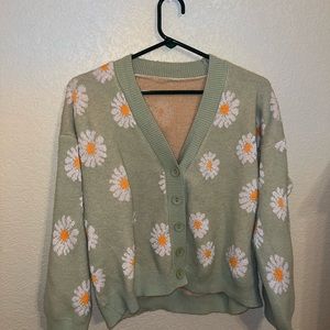 woman’s flower sweater